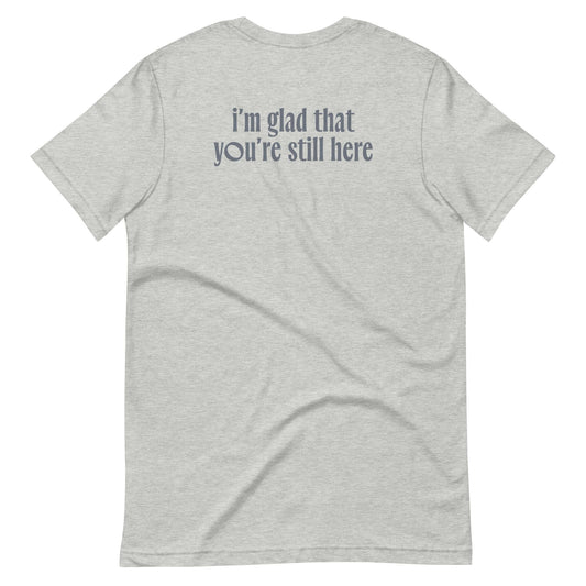 Back view of the  'I'm glad that you're still here' graphic t-shirt in light grey, made from 100% combed cotton.
